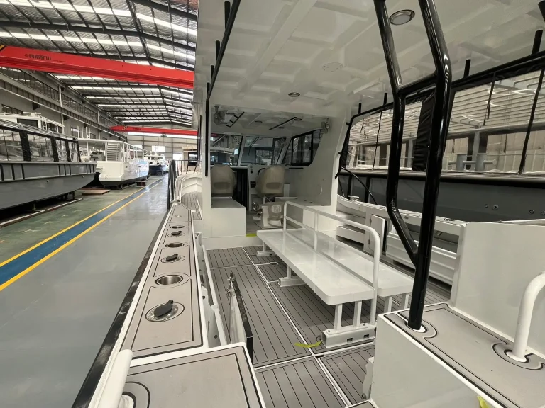 Cabin interior with bench seats and wide windows