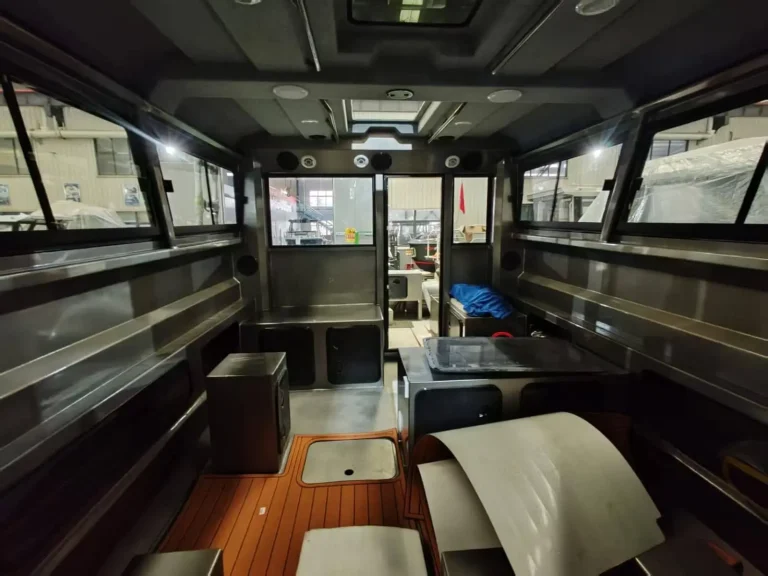 Cabin interior with timber floor and bench seats