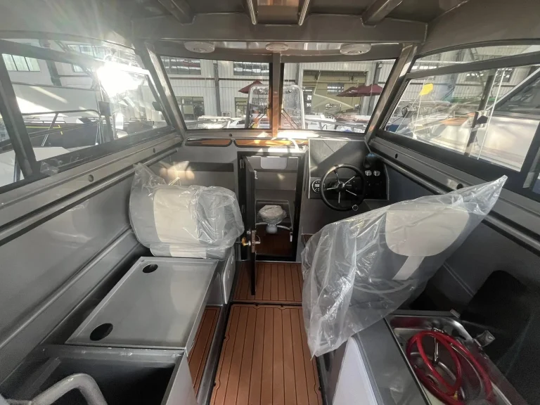 Cabin interior with timber floor and wrapped seat
