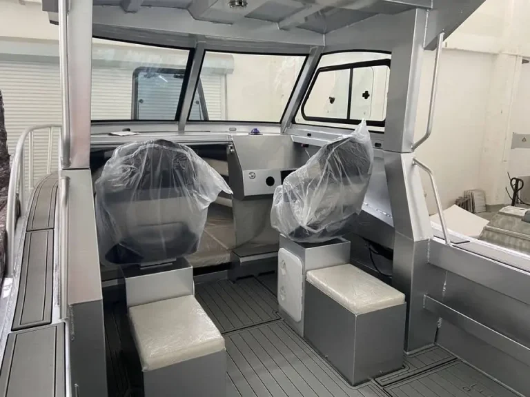 Cabin interior with wrapped helm seats and rear lounge
