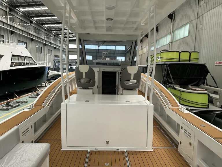 Cabin looking aft with galley module and side windows