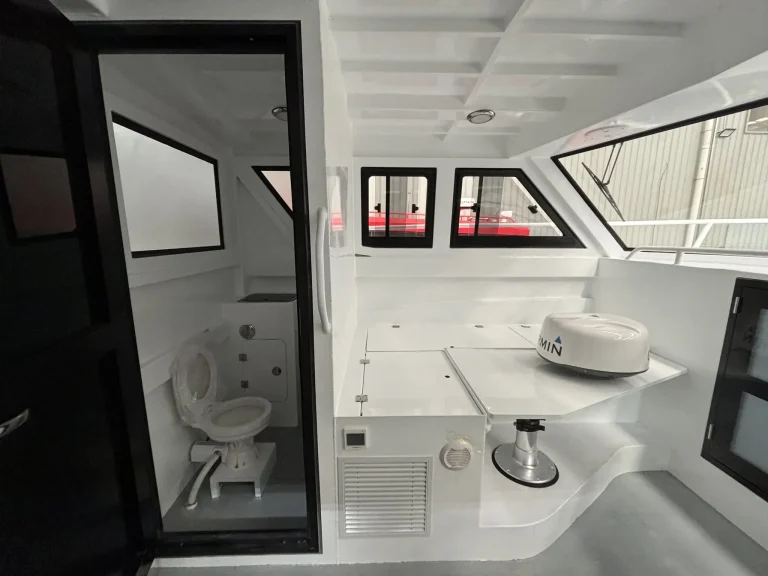 Cabin with toilet compartment and side door