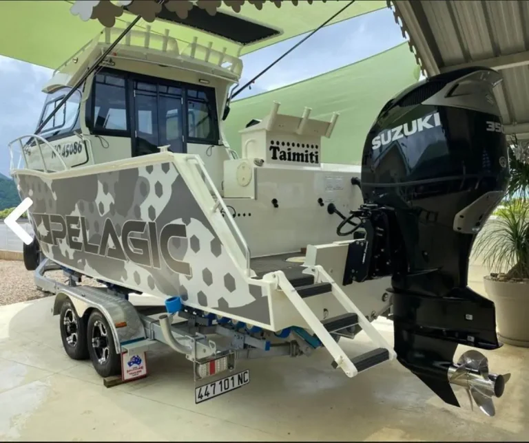 Camouflage wrapped hardtop boat with Suzuki outboard