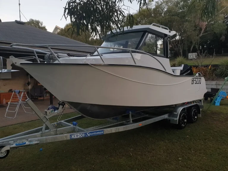 Champagne coloured hardtop plate aluminium boat on a trailer
