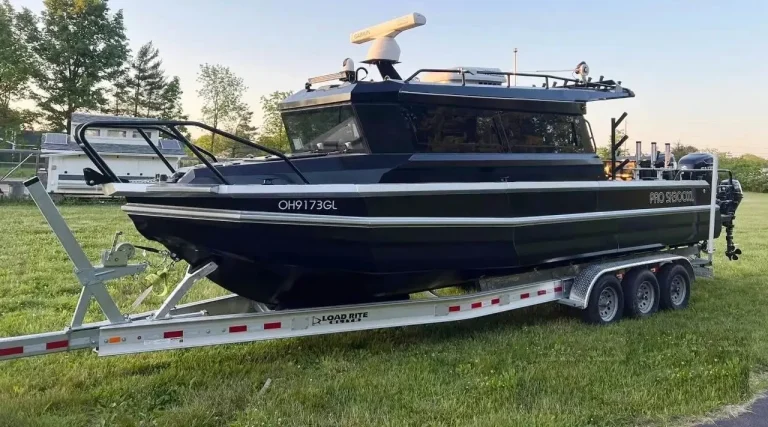 Charcoal plate aluminium hardtop boat on a tri axle trailer