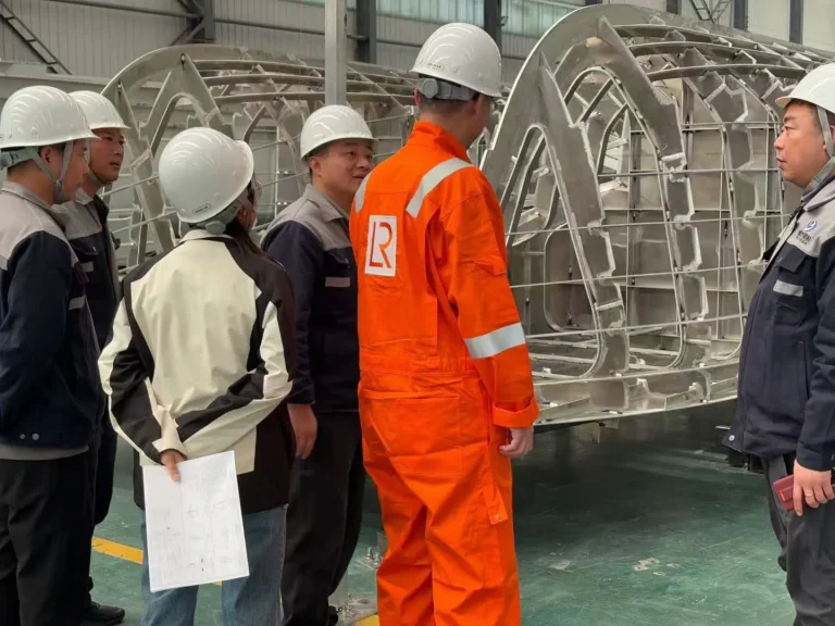 Class surveyors inspecting an aluminium hull frame