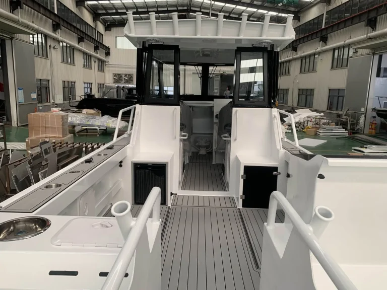 Cockpit looking forward to the cabin bulkhead doors