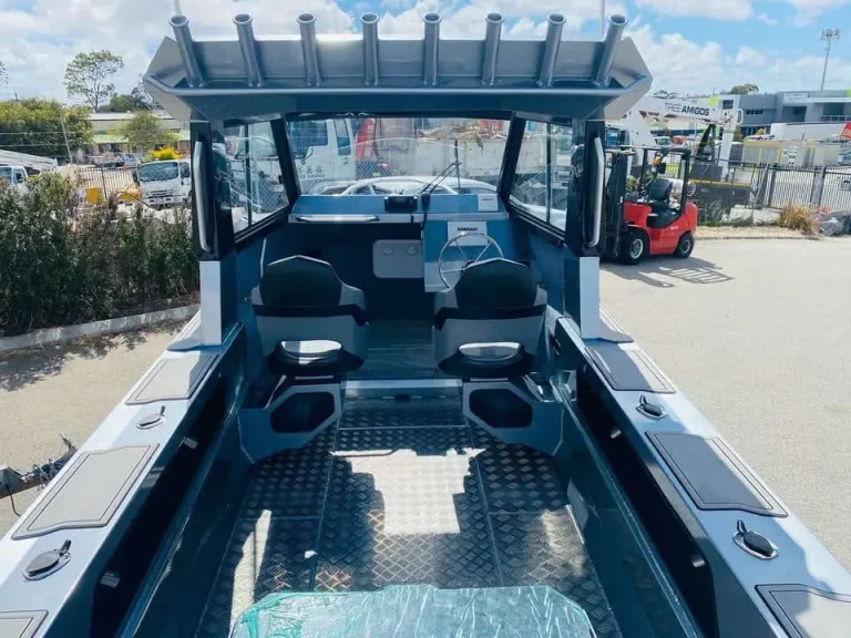 Cockpit looking forward with rod holders and checker plate