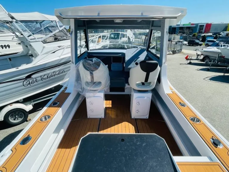 Cockpit with teak look floor looking aft to the transom