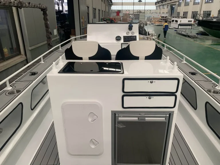 Console front with storage hatches and fridge