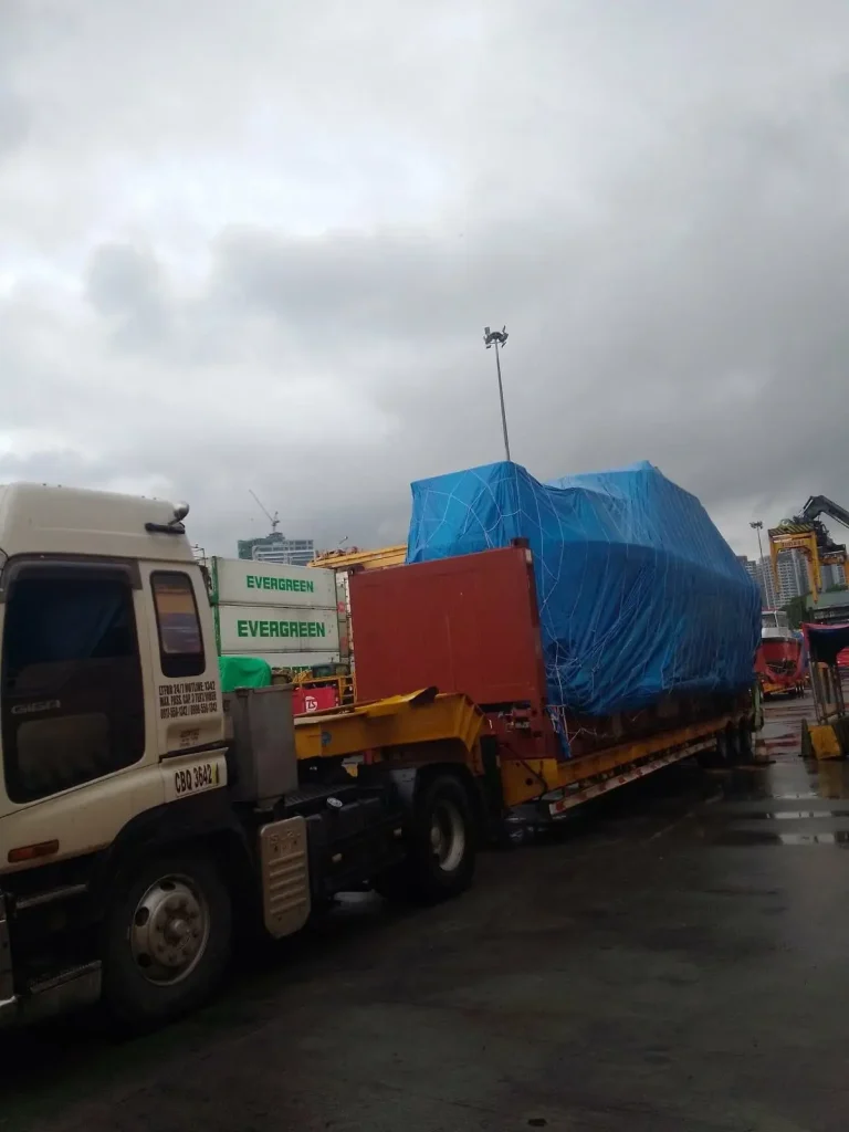 Covered boat on a truck ready for delivery