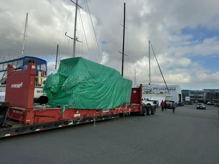 Covered plate aluminium boat loaded for transport