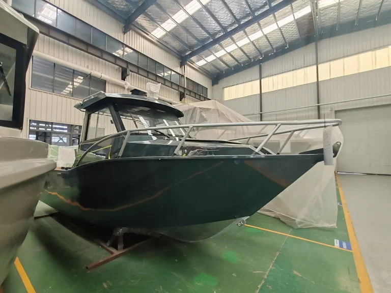 Dark green plate aluminium hull on stands