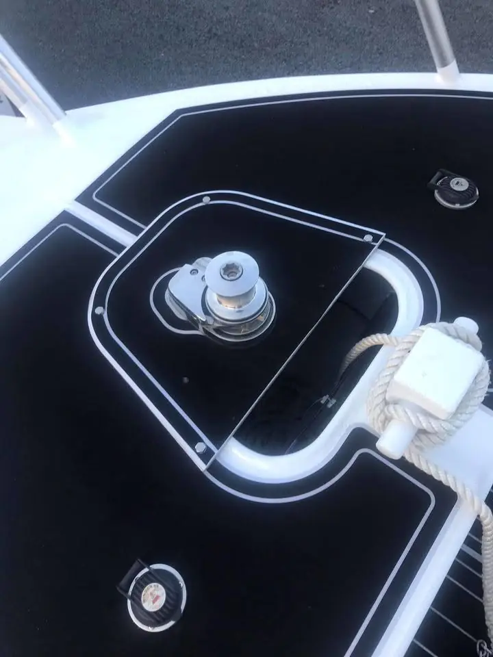 Deck fitting and rod holder detail on a plate aluminium boat
