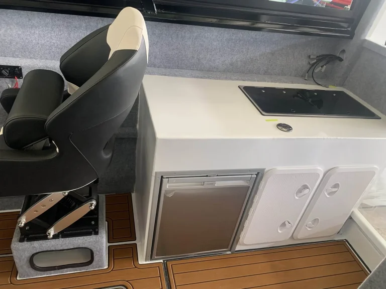 Galley bench and helm seat with teak look flooring