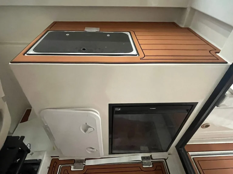 Galley bench with cooktop and timber look trim