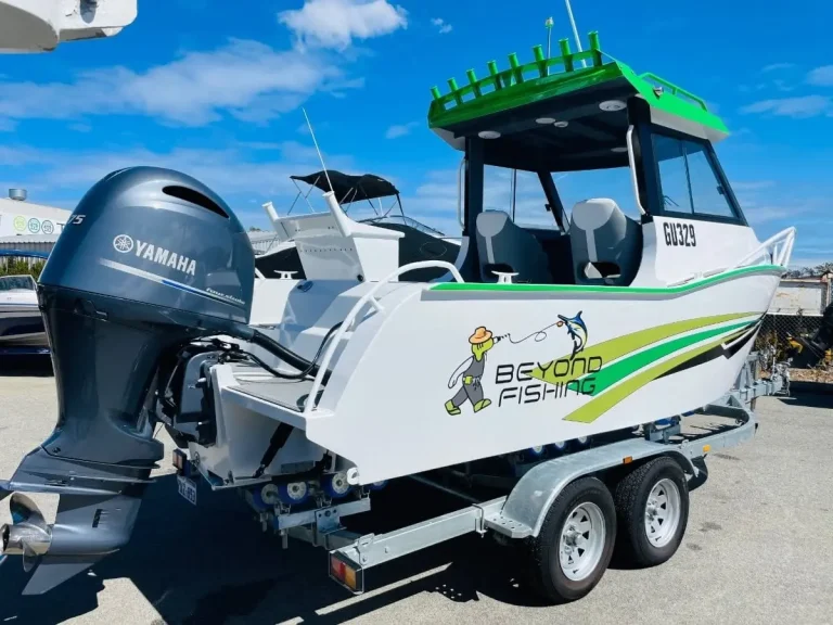 Green wrapped centre console with Yamaha outboard on a trailer