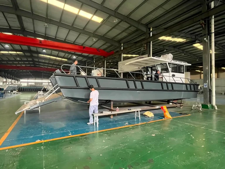 Grey landing craft under fit out in the factory