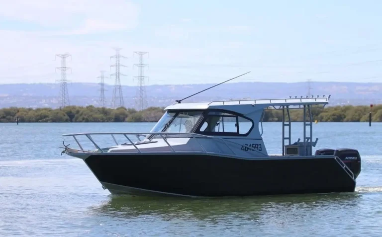 Grey plate aluminium cabin boat on a calm river
