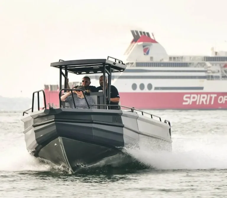 Grey plate aluminium centre console running past a ferry