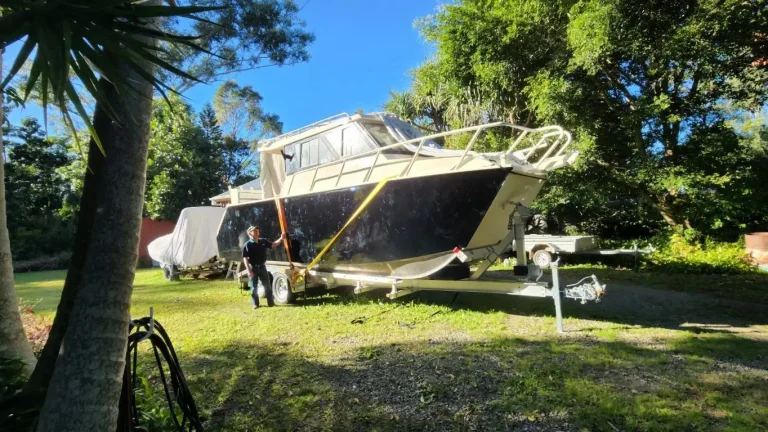Hardtop plate aluminium boat parked on a lawn