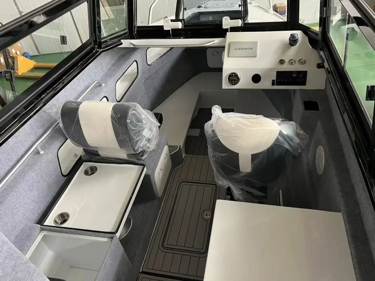 Helm console and toilet module inside a cabin