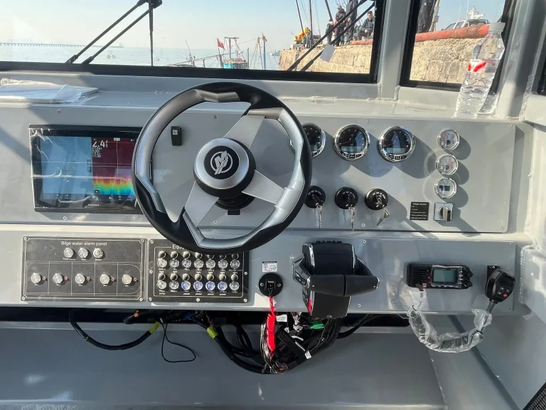Helm console with sports wheel and switch panel