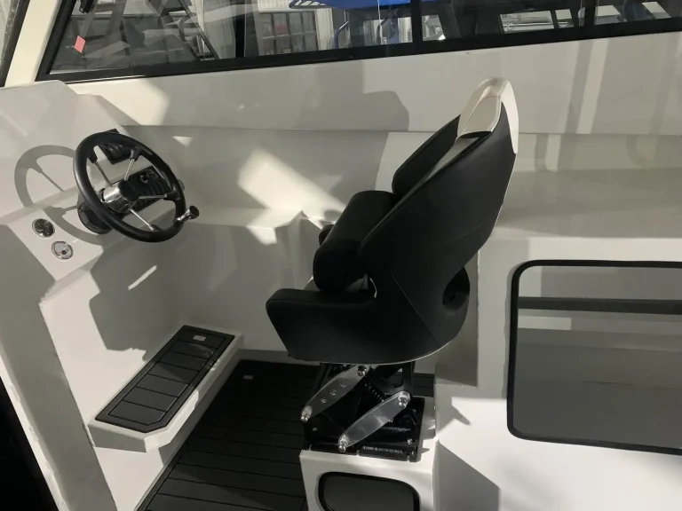 Helm console with wheel and folding seat