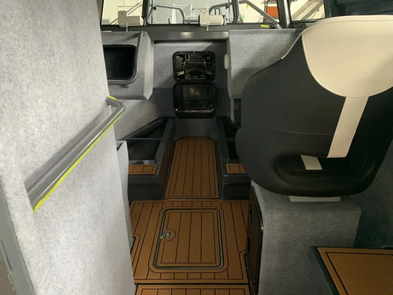 Helm seat and console inside a plate aluminium cabin