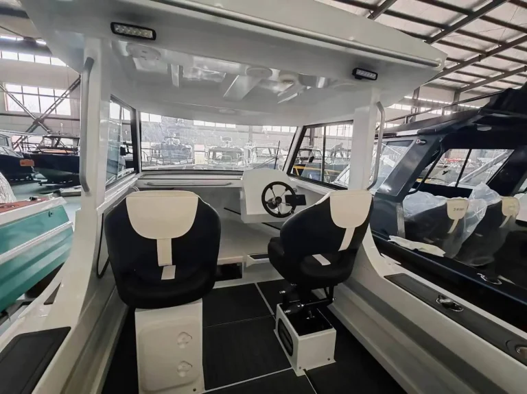 Helm seats and console inside a cabin boat