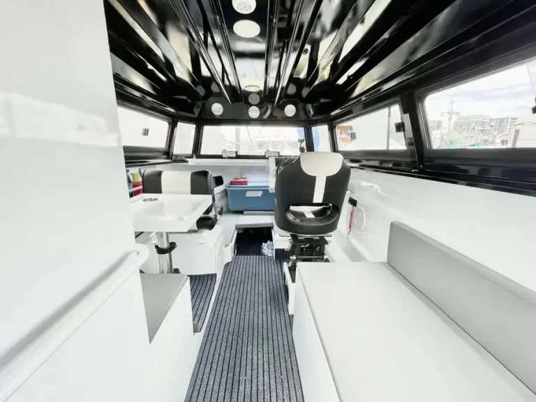 Helm seats under a hardtop looking forward