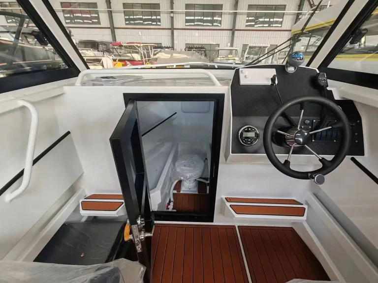 Helm wheel and cabin door with teak look flooring