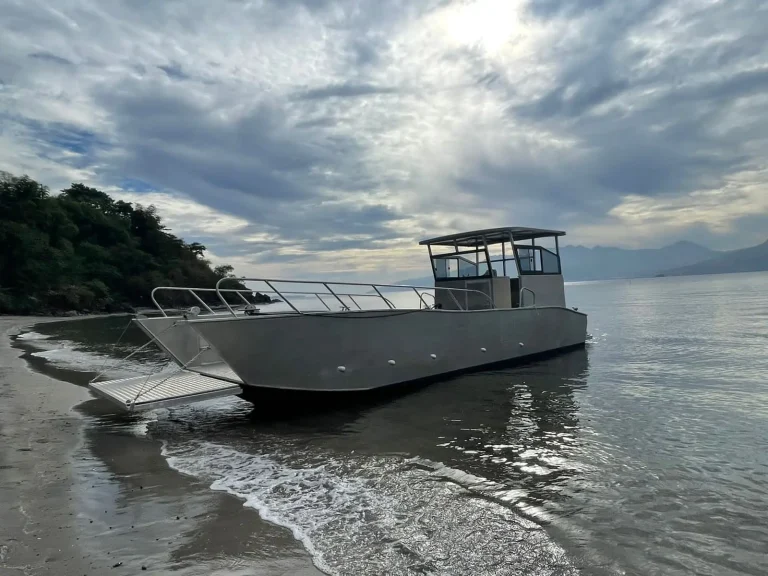 Landing craft with bow ramp on the shoreline