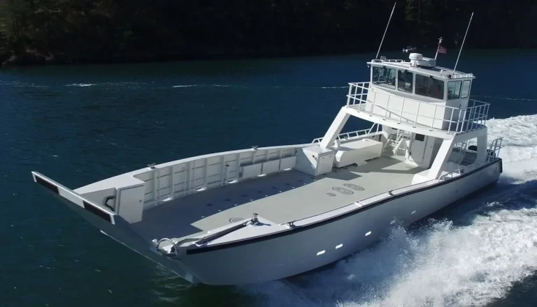 Landing craft with wheelhouse under way