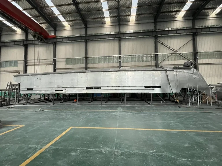 Long aluminium hull frame on the factory floor