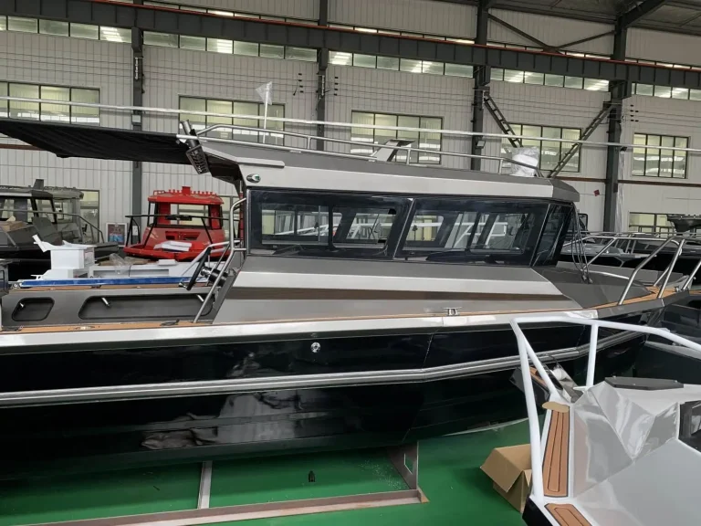 Long enclosed cabin plate aluminium cruiser nearing completion in the factory