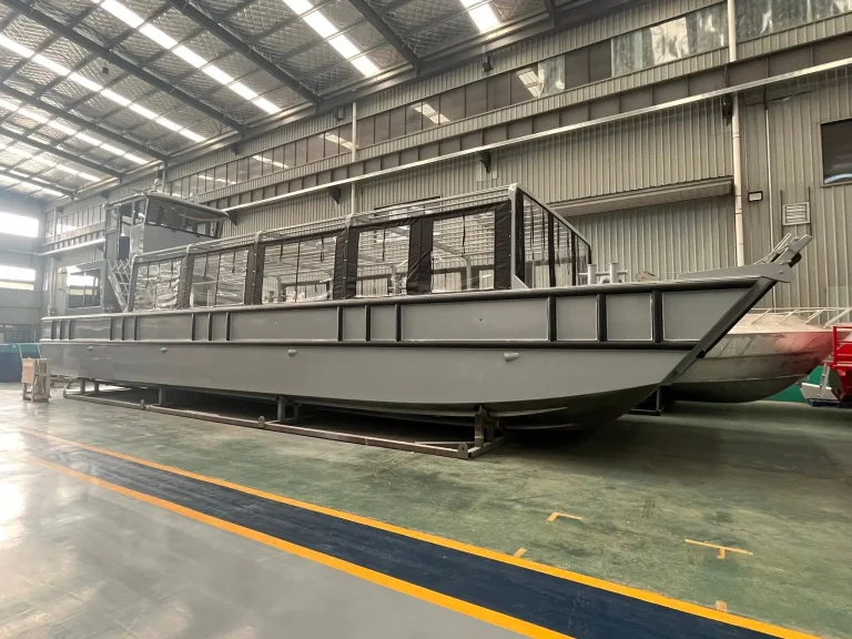 Long plate aluminium work boat on the factory floor