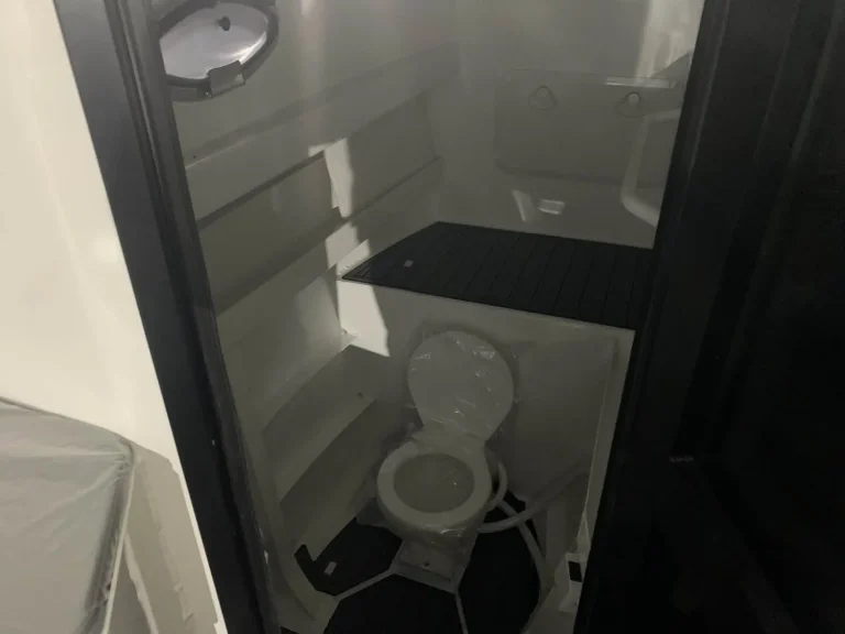 Marine toilet compartment inside a cabin boat