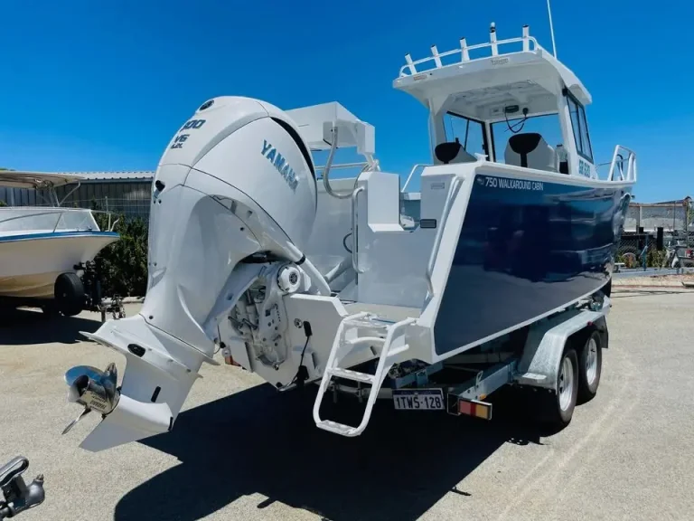 Navy centre console with Yamaha outboard on a trailer