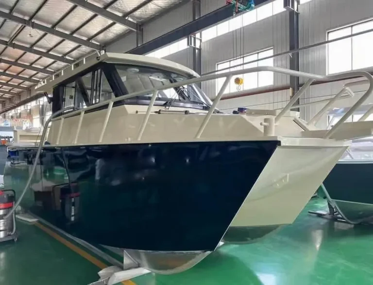 Navy plate aluminium hardtop boat berthed at a pontoon
