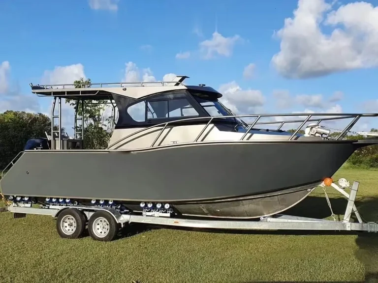 Open cabin boat with extended hardtop on a trailer