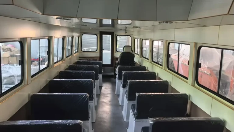 Passenger cabin with rows of seats and side windows