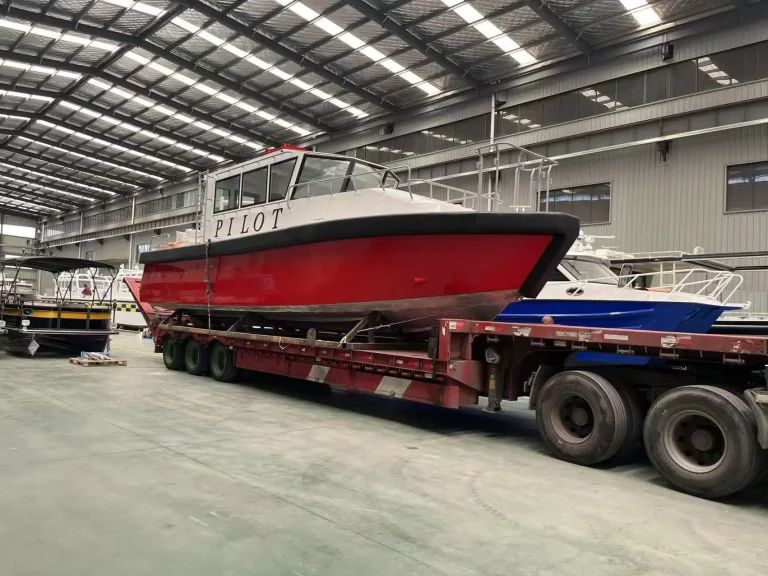 Pilot boat on a trailer inside the factory