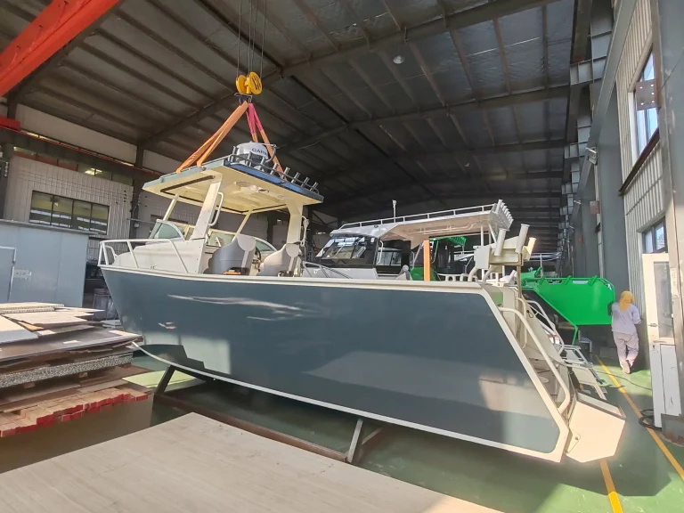 Plate aluminium boat lifted inside the factory