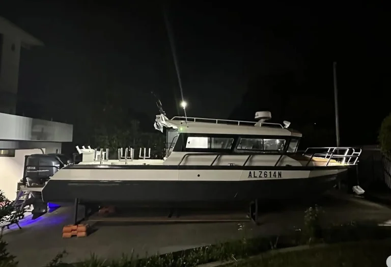 Plate aluminium boat on a trailer at night