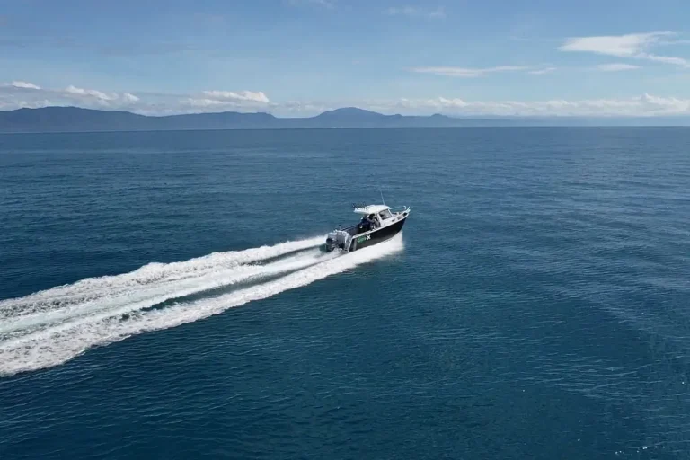 Plate aluminium boat running offshore seen from the air