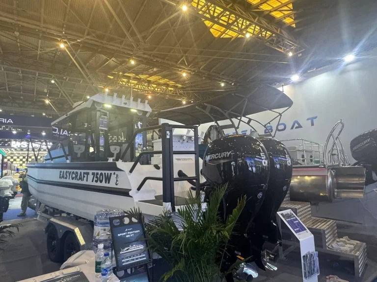 Plate aluminium boat with outboard at a boat show
