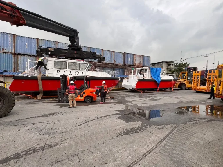 Plate aluminium boats craned at the dockside