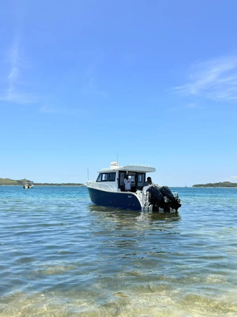 Plate aluminium cabin boat on clear tropical water