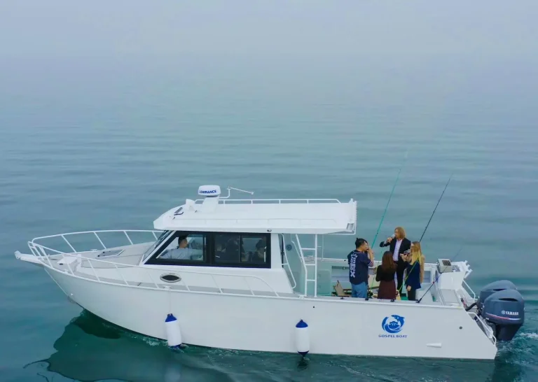 Plate aluminium cabin boat with anglers on clear water